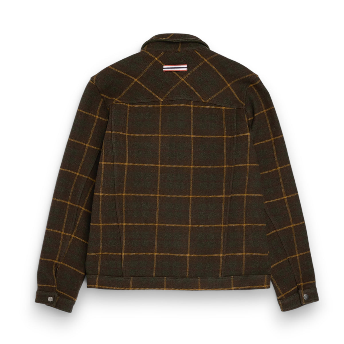 The AMUNDSEN SPORTS Wool Jacket is a unisex dark plaid overshirt with a brown and mustard check pattern, long sleeves, buttoned cuffs, and a small red, white, and blue striped tag near the back collar. Laid flat, viewed from behind.
