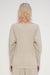 A person with shoulder-length blonde hair stands with their back to the camera, showcasing the MEIMEIJ Pleated Top from MEIMEIJ. The beige ribbed outfit features wide sleeves and a boat neck, set against a plain, light-colored background that complements its elegance.