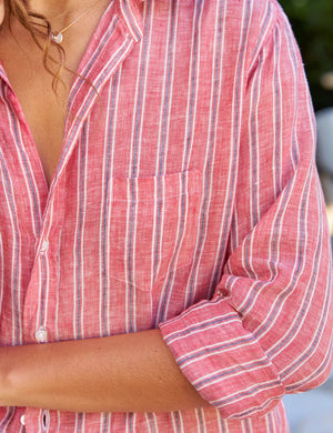 Introducing the FRANK AND EILEEN - EILEEN RELAXED BUTTON UP IN CLASSIC LINEN RED AND NAVY STRIPE. This button-up shirt features a red and navy striped pattern with long sleeves, rolled-up cuffs, and a collar. Crafted from classic linen for a lightweight and casual feel, it includes a pocket on the left chest and displays "Frank & Eileen EST 1947" inside at the collar. The design ensures bust-flattering button placement for that perfect relaxed fit.