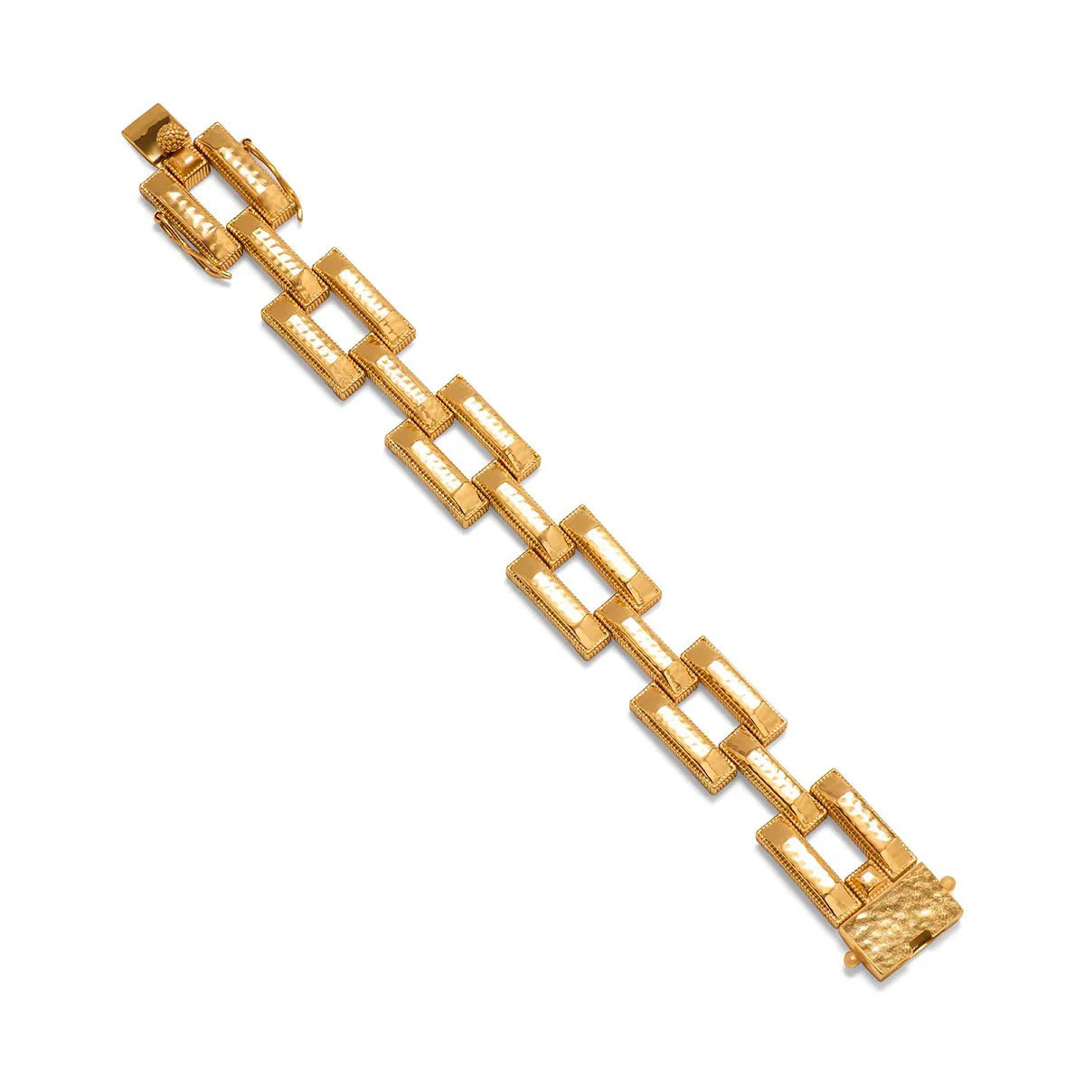 A close-up view of the CAPUCINE DE WULF - PATHWAY LINK BRACELET, GOLD showcases its handcrafted rectangular, textured links connected in a bold geometric pattern. This 18K gold bracelet features a shiny finish and clasp closure from the esteemed brand, CAPUCINE DE WULF.