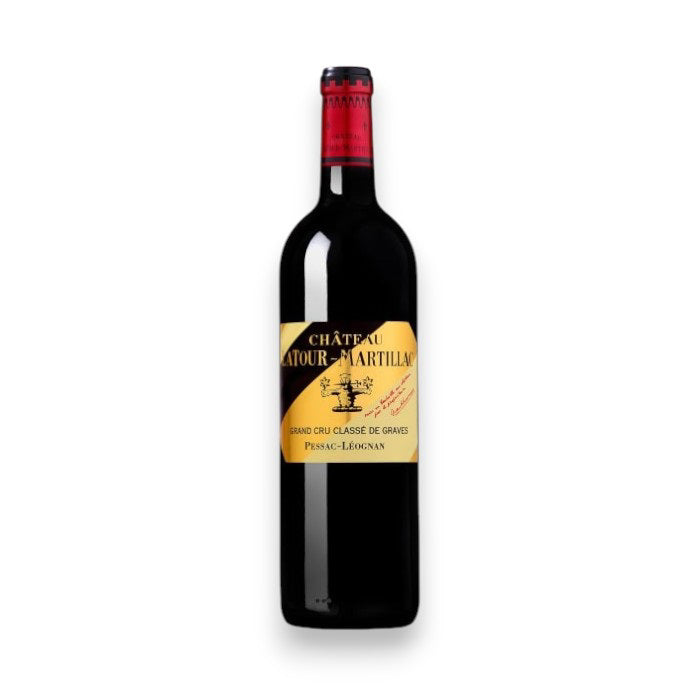 A bottle of Château Latour-Martillac Rouge 2019 by Monsieur Touton features a yellow label with text and a building image. The neck is wrapped in red foil, evoking lush black fruit flavors against a plain white backdrop.