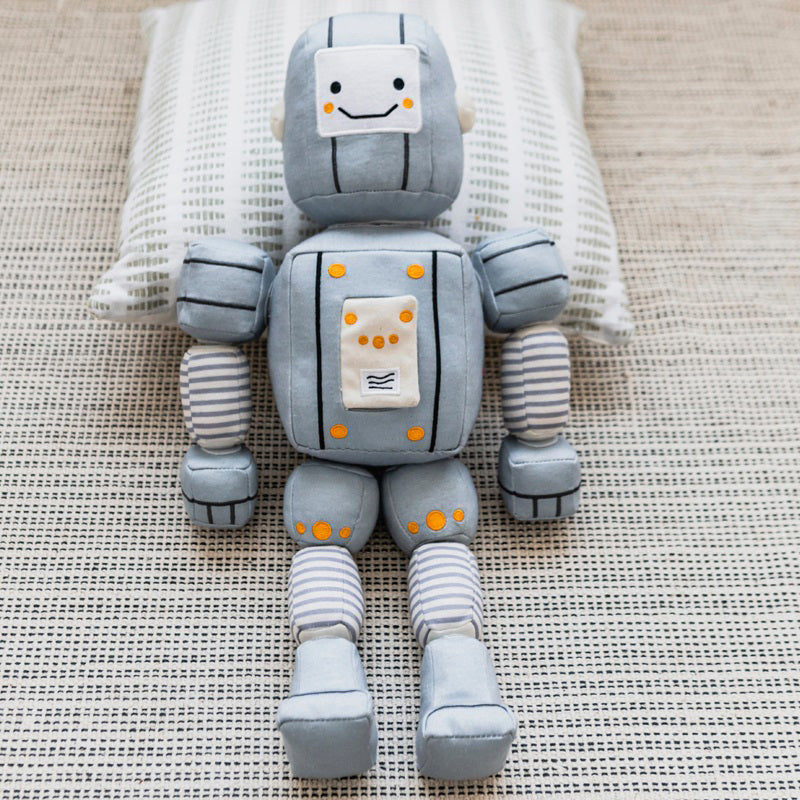 Description: Meet the TOT BOT from WONDER AND WISE ASWEETS, an educational toy designed to delight and educate. With its light gray body, segmented arms and legs, and cheerful yellow accents, this plush robot is sure to captivate. The friendly face sports black eyes and a happy smile, while the rectangular torso is adorned with colorful buttons and charming striped patterns on its limbs.