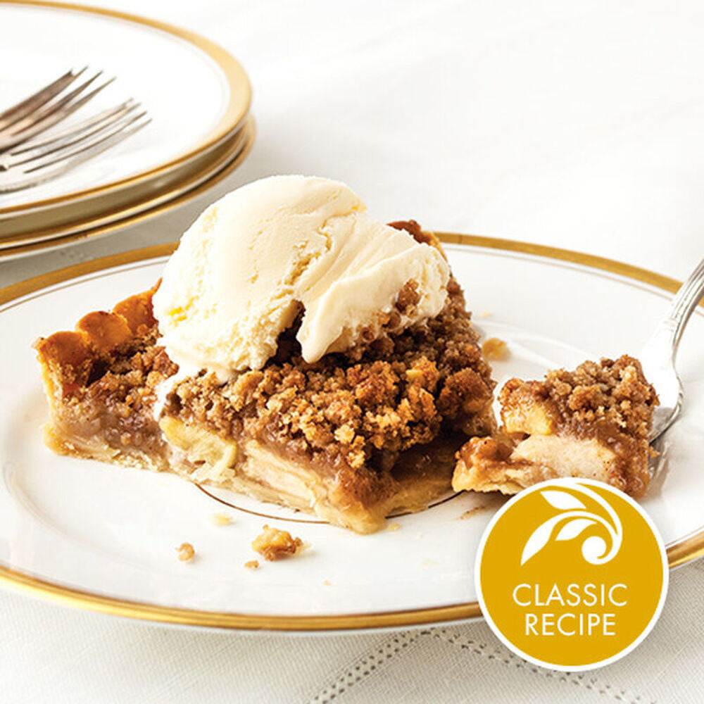 A jar of STONEWALL KITCHEN- BOURBON PECAN CRAMEL SAUCE with a dark green lid, featuring a white label. The label reads &quot;STONEWALL KITCHEN, Creators of Specialty Foods, Bourbon Pecan Caramel Sauce, Gluten Free, Net Weight 354g (12.5 oz).&quot; Perfect for elevating any dessert with rich caramel sauce and crunchy pecan pieces.