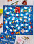 The vibrant family board game "DOGSCAPADES A BARKING MAD GAME" by PETITECOLLAGE showcases a winding game path embellished with dog-themed illustrations. The board comes complete with miniature canine character pieces, a die, and additional accessories, all while the game's box can be seen in the corner.