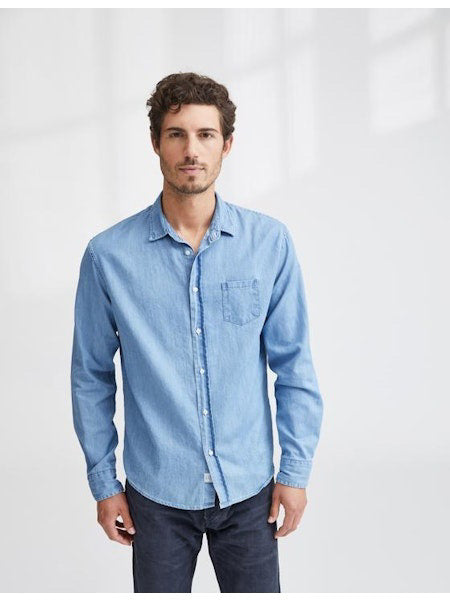The FRANK &amp; EILEEN LUKE Men&#39;s Button Up Shirt in Famous Denim Classic Wash features light blue 100% cotton denim, a loose fit, straight hem, and rolled long sleeves. Displayed from the back against a white background.