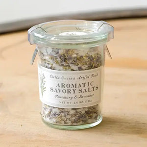 A small glass Weck jar with a metal clasp lid containing a seasoning blend. The label reads "BELLA CUCINA - ROSEMARY & LAVENDER SALT," offering a delightful Mediterranean flavor. The 2.6-ounce (75g) salt mixture is visible through the glass.