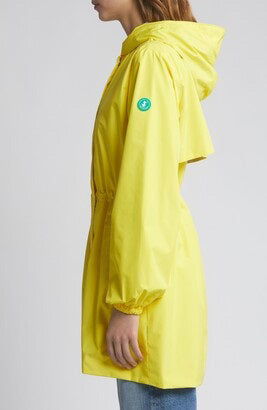 View of the SAVE THE DUCK - FLEUR Lightweight Rain Jacket from the back: a yellow, waterproof, hooded coat made from recycled polyester. It has long sleeves with elastic cuffs, a straight hem, and an overlapping flap detail on the upper back for added style and sustainability.