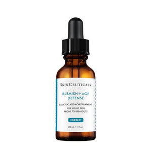 An amber glass dropper bottle with a black cap, labeled "SKIN CEUTICALS - BLEMISH AGE DEFENSE." This salicylic acid face serum is designed as an acne treatment for aging skin prone to breakouts. The label specifies the product volume as 30ml or 1 fl oz.