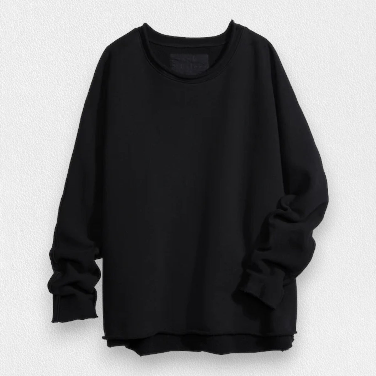 A person with long, wavy blonde hair is standing outdoors near a large tree, wearing the FRANK &amp; EILEEN ANNA LONG-SLEEVE CAPELET in navy over a white shirt and blue pants. The background showcases green foliage and a stone path. The person is smiling and gazing to the side.