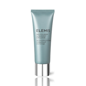 A tube of ELEMIS - PRO-COLLAGEN GLOW BOOST EXFOLIATOR by ELEMIS - STEINER lies next to a dollop of its contents on a light surface. Text explains the key ingredients: starflower oil, rose & mimosa waxes, padina pavonica, and cellulose exfoliating beads, highlighting their benefits.