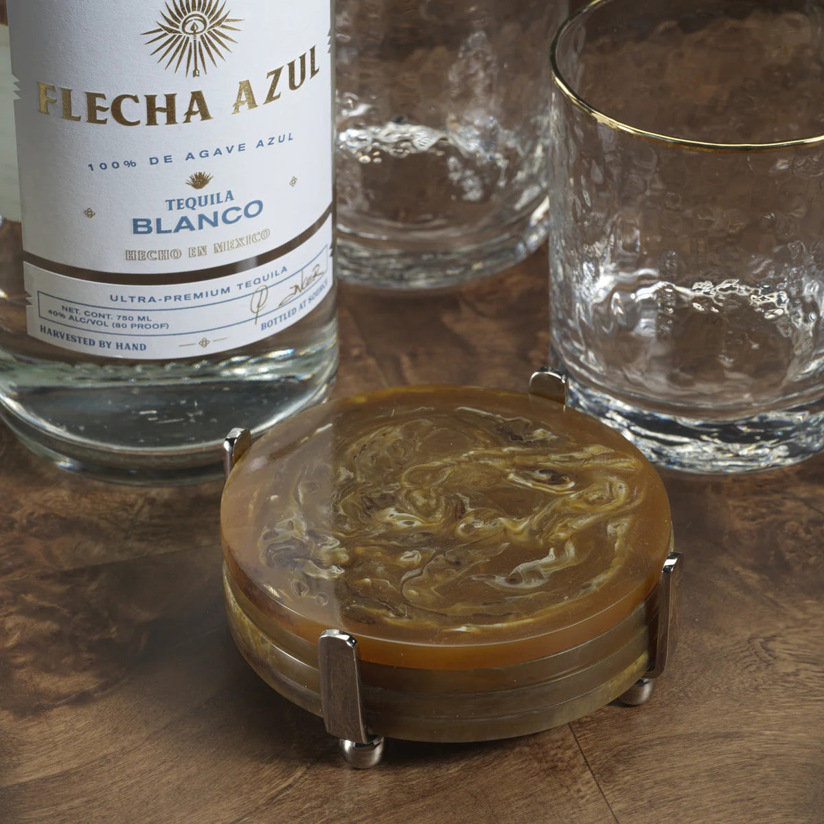 The ZODAX SPIGA Set of 4 Resin Coasters with amber accents comes on a stand and features a compact design, ideal for small spaces.