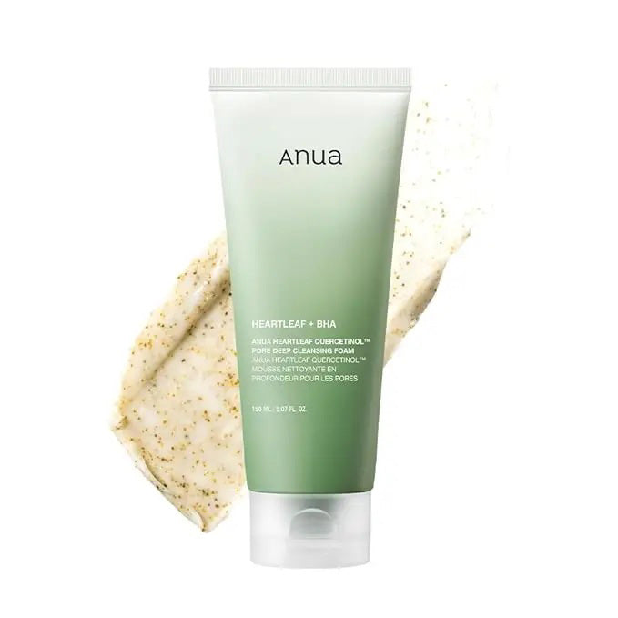 A green and white tube of ASIAN BEAUTY WHOLESALE DEEP CLEAN FOAM CLEANSER SEDUM HYALURON FOAM 150ML is shown with a swatch, highlighting its creamy texture and gentle exfoliating particles for deep pore cleansing.