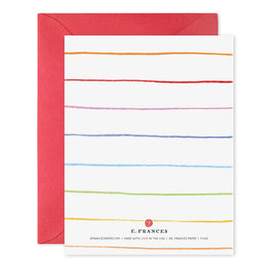 A greeting card named "Birthday Dots" from E.FRANCES PAPER is crafted on luxurious material, featuring vibrant horizontal stripes in a rainbow of red, orange, yellow, green, blue, and purple hues. It comes with a red envelope and has the text "E. FRANCES" at the bottom.