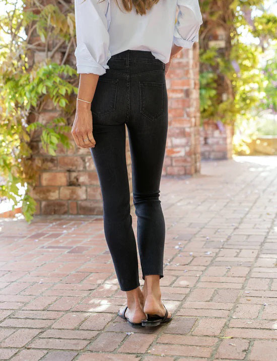 A pair of the FRANK &amp; EILEEN Sligo Skinny Jeans in the 1991 Wash is laid flat against a plain white background. These jeans feature a high-rise contour waistband, five pockets, and a slightly faded design on the thighs, offering a stylish and modern look with Italian Performance Denim for added comfort.