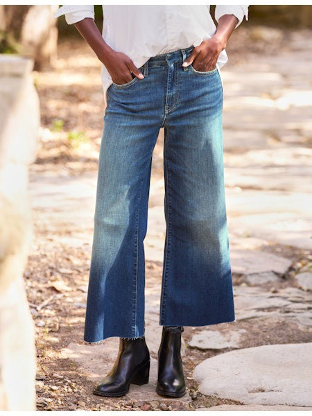 The FRANK &amp; EILEEN Galway Wide Leg Jean in 1999 Wash features a faded ombre effect, cropped raw hem with unfinished edge, classic five-pocket styling, and visible stitching for an effortlessly cool look.