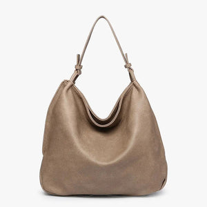 The JEN & CO RUSTIC TOTE is crafted from brown vegan leather and features a relaxed, slouchy shape. Its simple and elegant design includes a single strap attached at both sides, along with an inner compartment for added functionality, all set against a plain light background.