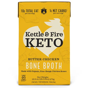 A yellow carton of KETTLE & FIRE - BUTTER CHICKEN KETO BONE BROTH is shown. Nutritional information includes 10g total fat and 1g net carbs per serving. Made from organic, free-range chicken bones and grass-fed butter, it boasts a velvety-smooth finish. The net weight is 16.9 oz (479g) and it's labeled gluten-free.