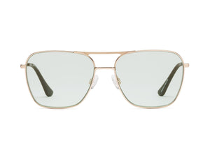 The CADDIS - HOOPER READERS feature square aviator-style frames made from lightweight gold metal, paired with scratch-resistant green-tinted lenses. Clear nose pads ensure comfortable wear, while the dark-finished arms elegantly contrast against a plain white backdrop.