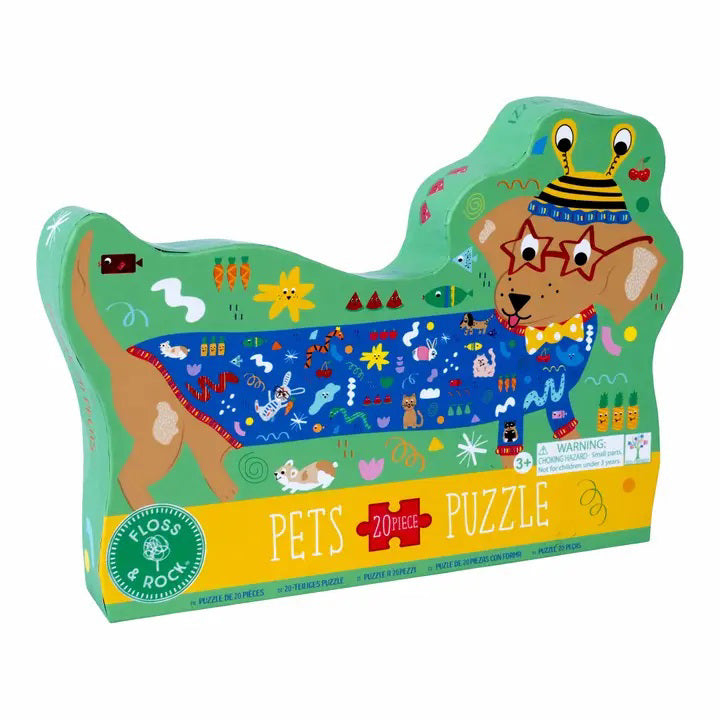 The FLOSS AND ROCK - SAUSAGE DOG PUZZLE (20PC) is a vibrant, eco-friendly puzzle designed for children aged 3 and up. This colorful 20-piece box features chunky pieces that form a playful sausage dog adorned with glasses and a hat, highlighting delightful illustrations of various pets and fun patterns. The label proudly reads &quot;Pets Puzzle&quot; by Floss &amp; Rock.
