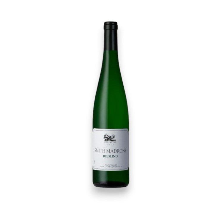 A Smith-Madrone Riesling 2018 bottle from Ocean South Imports features a green glass body with a long neck and black cap. Its white label includes text and a small tree illustration, evoking crisp Meyer lemon notes, set against a plain white background.