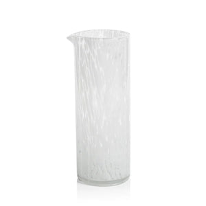 Presenting the AMALFI WHITE TORTOISE PITCHER by ZODAX: a tall, cylindrical clear glass pitcher with a small spout on one side. With a capacity of 946 ml (32 oz), this elegant piece features a textured, marbled pattern and boasts an elegantly simple design.