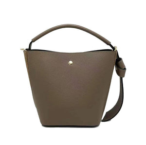 Introducing the SMALL LEATHER BUCKET HANDBAG by LE BORSETTE: This sleek white handbag boasts a structured design with a single top handle and detachable crossbody straps. With its minimalistic style and tiny gold accent on the front, its clean lines and smooth texture provide a modern, sophisticated look.