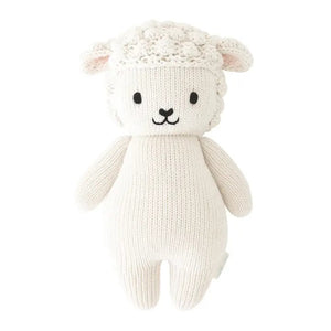 Introducing the CUDDLE + KIND - HANDMADE BABY LAMB by CUDDLE & KIND. This delightful knitted stuffed toy is crafted from 100% cotton yarn and features a white, wool-like texture. It has adorable black eyes, a smiling mouth, and small round ears. The toy’s body boasts a simple design with a smooth and plush finish. Perfect as one of your fair trade baby gifts!