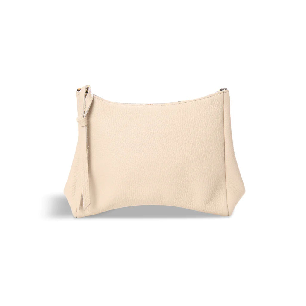 A small, light beige leather OLIVEVE - CAMILA CLUTCH made from Italian Buffalo Cowhide Leather with a zipper closure and a textured surface. The simple rectangular design features slightly rounded corners and a slim pull tab attached to the zipper, accented by a teardrop gusset design. Positioned against a white background.