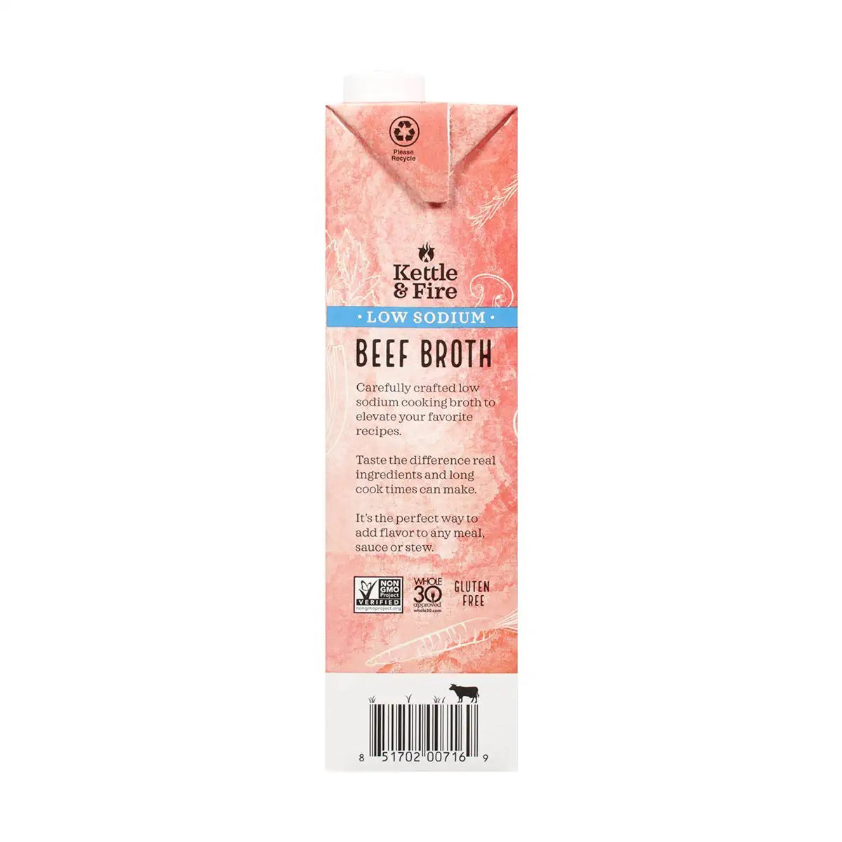 A red and black carton of KETTLE & FIRE - GRASS FED LOW SODIUM BEEF COOKING BROTH 32OZ. The front displays labels such as "100% Grass-Fed," "No Preservatives," "Low Sodium," and "Beef Broth." With a 32 oz (907g) capacity, icons indicate it is a slow-simmered, high-quality cooking broth perfect for enhancing recipes.