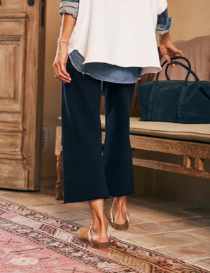 The image showcases the FRANK & EILEEN - CATHERINE Favorite Sweatpant in British Royal Navy, featuring a fashion-forward wide-leg cropped fit with a drawstring waist. The mid-rise sweatpants are displayed against a plain white background.