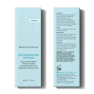 A 30 ml bottle of SKINCEUTICALS - DISCOLORATION DEFENSE serum from SKIN CEUTICALS, featuring a white design with a black dropper cap. The label highlights it as a multi-phase serum that targets visible skin discoloration and serves as a dark spot corrector for achieving brighter-looking skin.