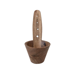 The Creative Coop Acacia Wood Herb Stripper features a long handle with three holes for an ergonomic grip, a deep rounded bowl, and maintains a natural wood grain finish for a rustic appearance.