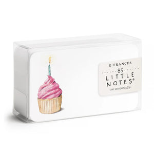 The "PINK CUPCAKE LITTLE NOTES" from E.FRANCES PAPER features an enchanting cupcake design with pink frosting and a lit candle. This adaptable card, characterized by its rounded corners and subtle logo, is elegantly displayed against a simple white background.