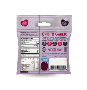 A small white pouch with the brand name "POSHI" in large red letters at the center. The package states "Chili & Garlic" flavor and "Natural Kalamata Pitted Olives." Highlighting "Low Calorie Snack," this vegan snack features a graphic of Greek olives, one larger and one smaller.