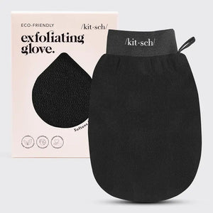 A black EXFOLIATING GLOVE, designed for skin care, is shown in front of its eco-friendly packaging from KITSCH. The light beige packaging highlights the product name and icons indicating benefits like being vegan and cruelty-free, making this body scrubber mitt an ideal addition to your routine.