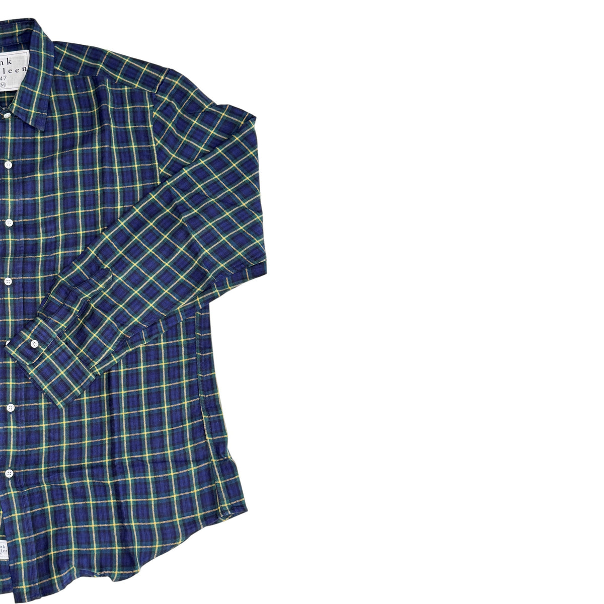 The FRANK &amp; EILEEN Finbar Button Up Shirt, in navy, green, and yellow Italian flannel plaid, is laid flat on a white background showing only the left side of its relaxed fit.