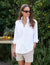 The FRANK AND EILEEN - EILEEN RELAXED BUTTON UP IN TRIPLE FLEECE WHITE features a collared neckline, buttons down the front, and a single chest pocket. The long sleeves are rolled up, and the inside collar label reads "Frank & Eileen EST 1947." With its relaxed fit and slightly curved hem, it exudes a casual, laid-back vibe.