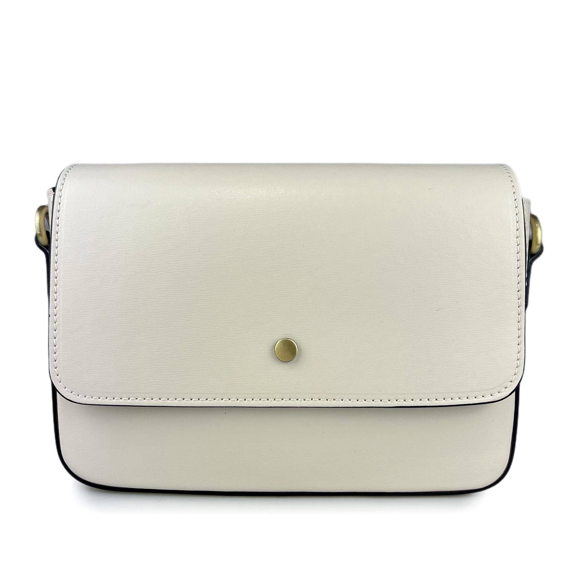 The RIGID LEATHER HANDBAG by MIRAMI FIRENZE is a cream-colored leather handbag with a minimalist design. It features a flap closure with a single metallic button in the center, black edging, brass hardware on the strap attachments, and an adjustable shoulder strap for versatility. Crafted from real leather, it also includes internal pockets for organization.