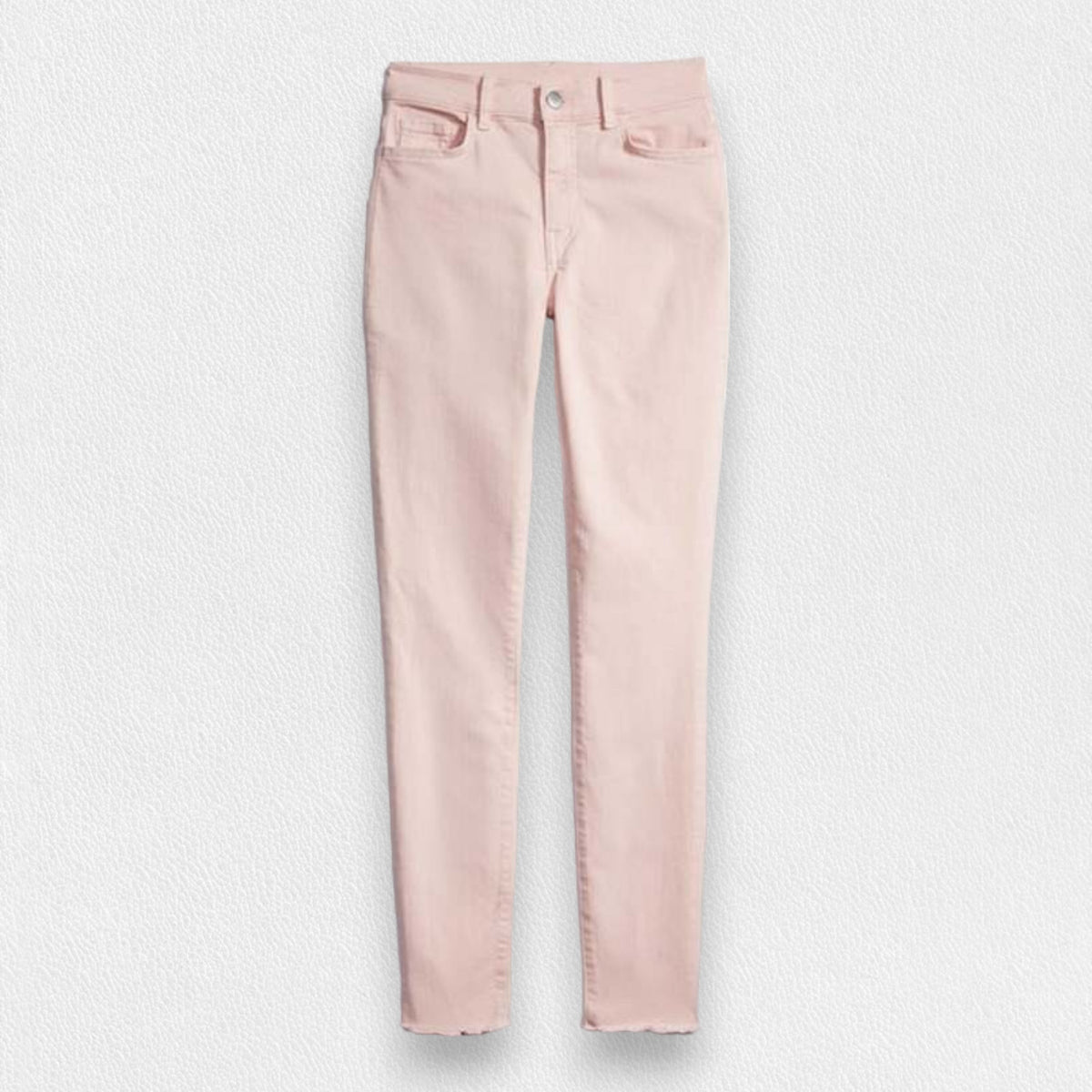 The FRANK &amp; EILEEN SLIGO SKINNY JEAN is a pair of beige, high-waisted skinny jeans crafted from sustainable Italian Performance Denim. They feature a high-rise contour waistband, five pockets, button and zip closure, and a &quot;Frank&quot; label on the waistband. The jeans are displayed against a white textured background.