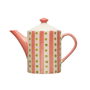 A TEAPOT WITH STRAINER from CREATIVE COOP, hand-painted stoneware showcasing a vibrant design with vertical red stripes and yellow polka dots on a white background. This teapot features a curved spout, a handle matching the stripes, and a lid topped with a small, rounded red knob.