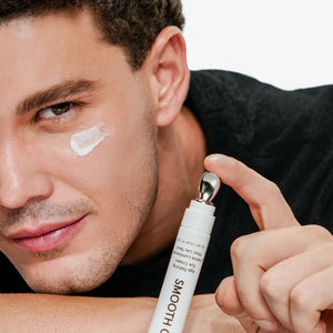 A white tube of JAXON LANE - SMOOTH CRIMINAL AGE DEFYING EYE CREAM for dark circles and under eye bags stands upright against a plain white background.