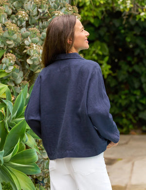 The FRANK & EILEEN Gabi Popover Shirt in Linen Navy is a flowy, feminine top with bracelet-length sleeves and a wide open collar, no visible buttons, shown laid flat on a white background.