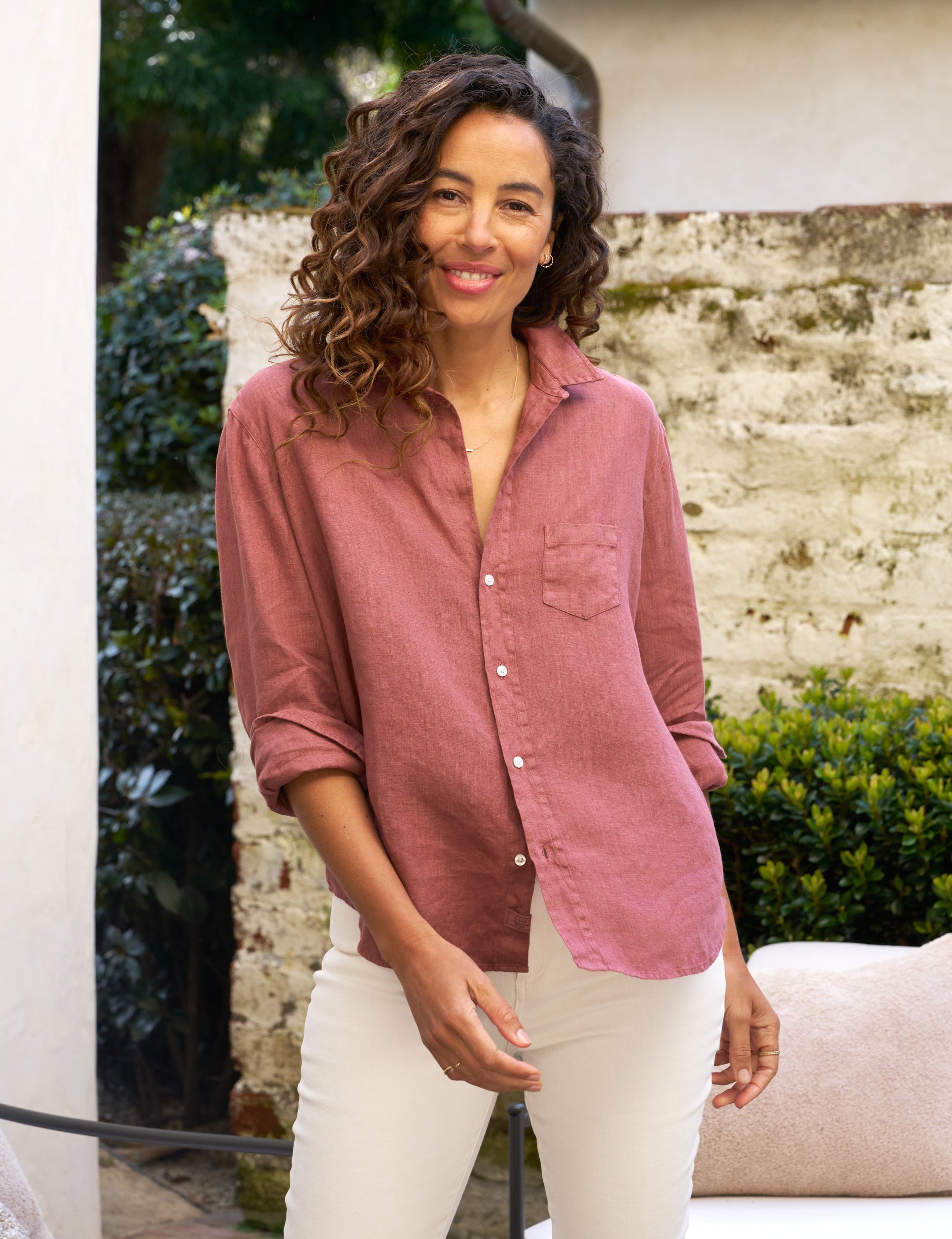 The FRANK & EILEEN Eileen Relaxed Button-Up Shirt in Mauve Washed Linen is a long-sleeved button-up shirt featuring a collar and a single chest pocket. The washed linen fabric provides a slightly textured appearance, with the sleeves casually rolled up for a laid-back style. This relaxed fit shirt is showcased against a plain white background.

