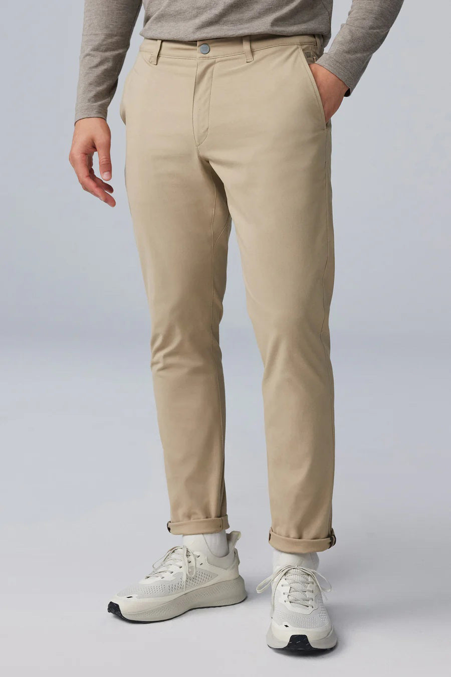 The MACK WELDON - MAVERICK TECH CHINO is a beige, stain-resistant pair of chinos with a straight-leg cut, button closure, and side pockets, shown laid flat on a white background.