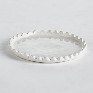 The NAPA HOME AND GARDEN MADDIE PETITE ROUND TRAY is a versatile piece with a white ceramic construction and fluted edges. Its slightly worn, smooth surface shows a few light scratches with a subtle gloss finish. Photographed from above on a plain white background, it perfectly complements any home decor.