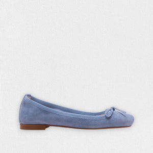 The MICHELE LOPRIORE - PALOMA ballet flat with a square toe, crafted from genuine silver leather, features a delicate bow on the front and a low-profile brown sole. Made in Italy, this elegant shoe is set against a plain white textured background.