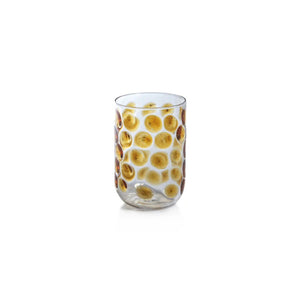 The AIRELLES GLASS TUMBLER by ZODAX is a clear, cylindrical Borosilicate glass adorned with raised circular patterns in a golden or amber tint. It has a capacity of 460 ml and is set against a plain white background.