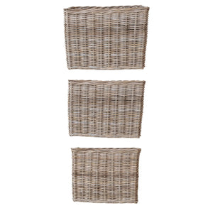 Three SMALL WOVEN WICKER RATTAN BASKETS WITH HANDLES from CREATIVE COOP of varying sizes are placed vertically in a straight line against a white background. Each basket features intricately woven rattan material and an open top.