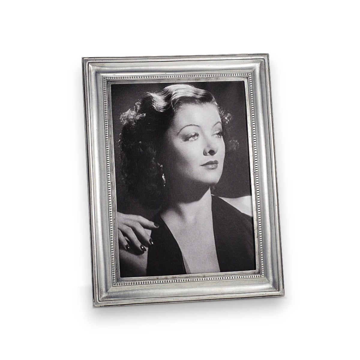 A black-and-white portrait of a woman in vintage attire is elegantly displayed in the MATCH - TOSCANA PEWTER PHOTO FRAME LARGE by MATCH, making it an ideal choice for personalized gifts.