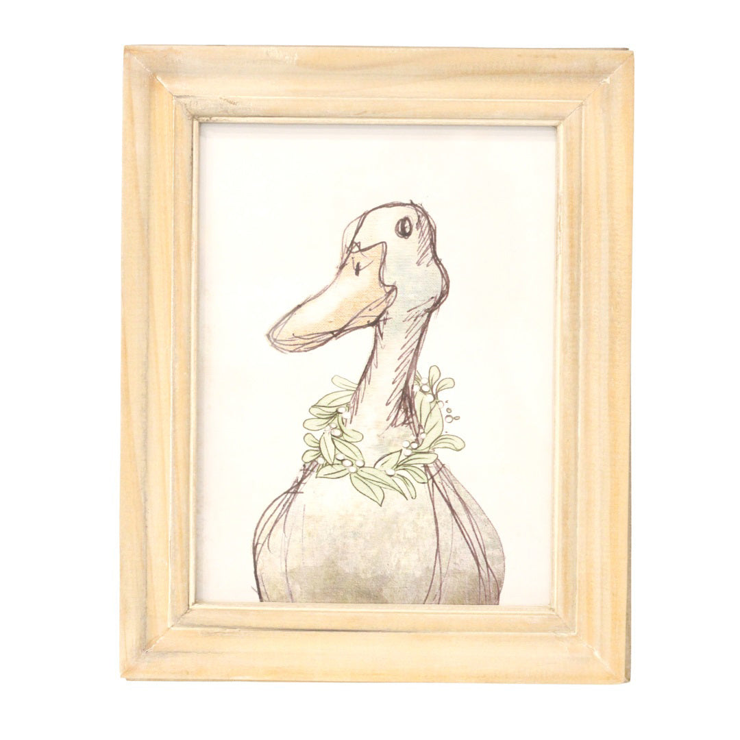 Introducing the FRAMED DUCK ART from CREATIVE COOP: This charming piece features a duck adorned with a wreath of leaves around its neck, rendered in a simple, sketch-like style with soft pencil lines and a light background. It comes in a light-colored wood frame that exudes a rustic, weathered appearance. Perfect for adding character to any space!